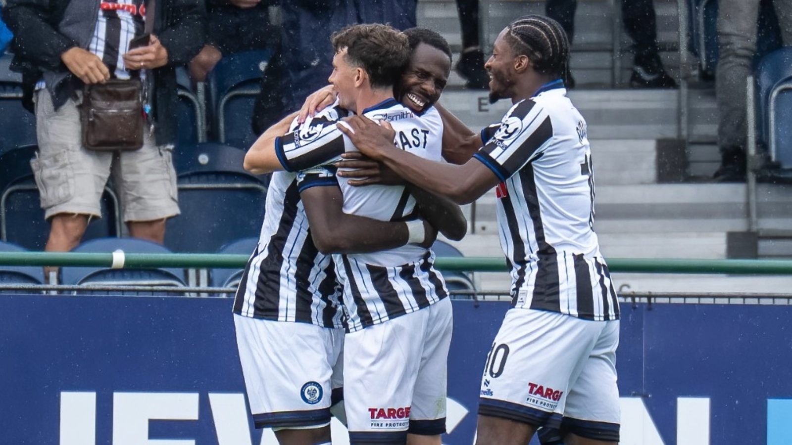 Ryan East, centre, scored the equaliser for Rochdale against Scunthorpe United