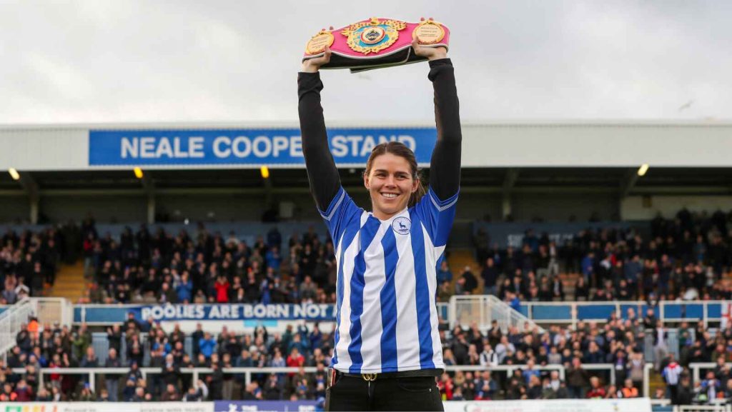Savannah Marshall at the Prestige Group Stadium with one of her world championship belts.