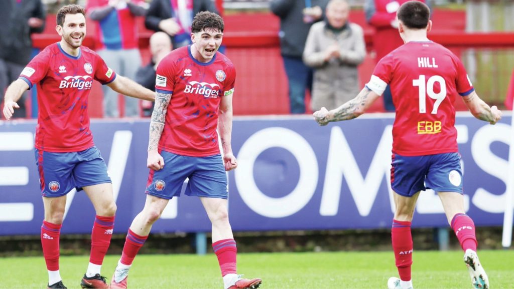 Aldershot scorer Sean Patton, centre, celebrates with Hady Ghandour, left, and Ryan Hill