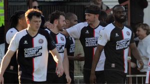 Liam Dulson is mobbed by team-mates after doubling Maidenhead United’s lead
