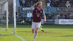 Oli Bainbridge punches the air after adding number four for South Shields