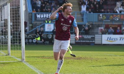 Oli Bainbridge punches the air after adding number four for South Shields