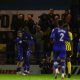 Emmanuel Dieseruvwe and Tarryn Allarakhia celebrate as Rochdale open the scoring against Brackley Town