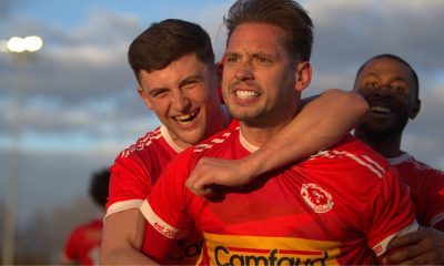 Jack Hopkins celebrates after firing Punjab United into the FA Vase semi-finals with a dramatic late winner.