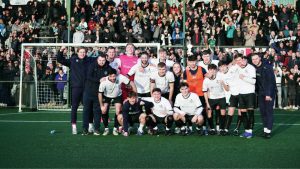 Marine players and supporters celebrate their giant-killing