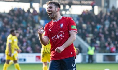 Ollie Pearce celebrates scoring for York City against Brackley Town