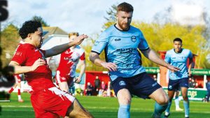 Poole’s Selim Saied, left, and Gloucester’s Morgan Lewis battle for the ball