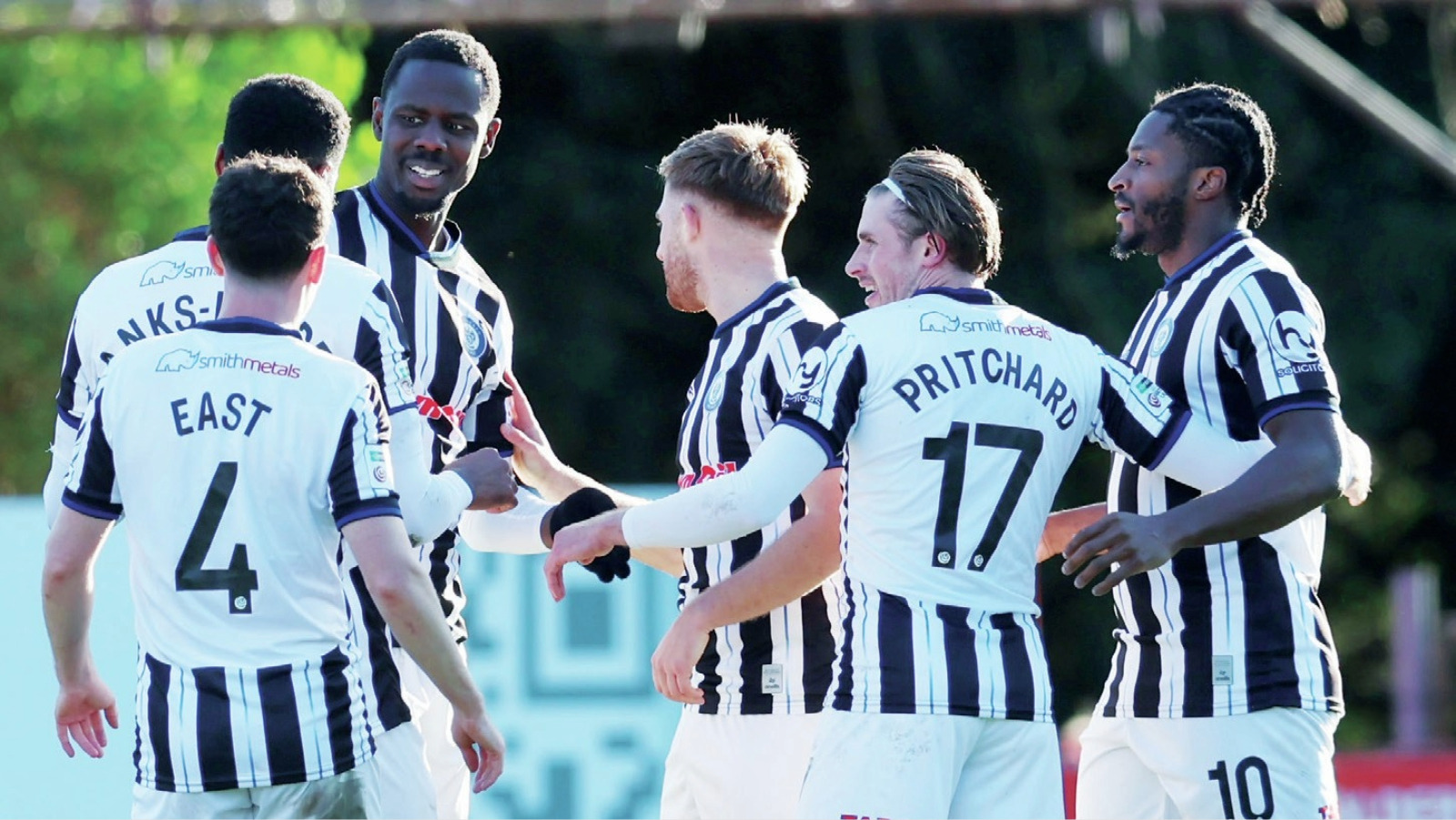 Dale team-mates celebrate with two-goal hero Mani Dieseruvwe