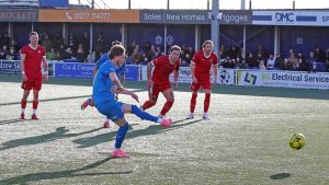 Teddy Collis scores Billericay Town’s winning penalty