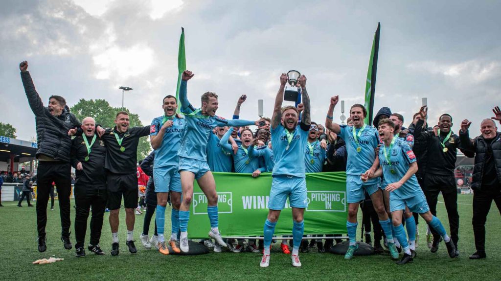 Enfield Town lift the trophy after securing promotion to Step 2