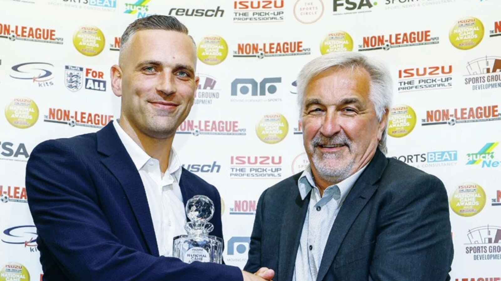 Joe Taylor, left, picks up his award from SK Kits’ Ian Senior