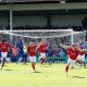 York City players wheel away in jubilation after Josh Stones squeezes in their winner