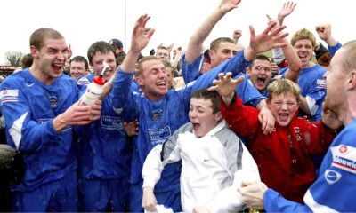 Accrington Stanley players celebrate winning promotion to the Football League