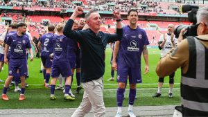 AFC Stoneham boss James Phillips soaks in the Wembley atmosphere after guiding the Purps to FA Vase glory