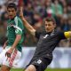 Tommy Smith, of New Zealand, lunges to thwart Mexico’s Raul Jimenez during a 2014 World Cup play-off game