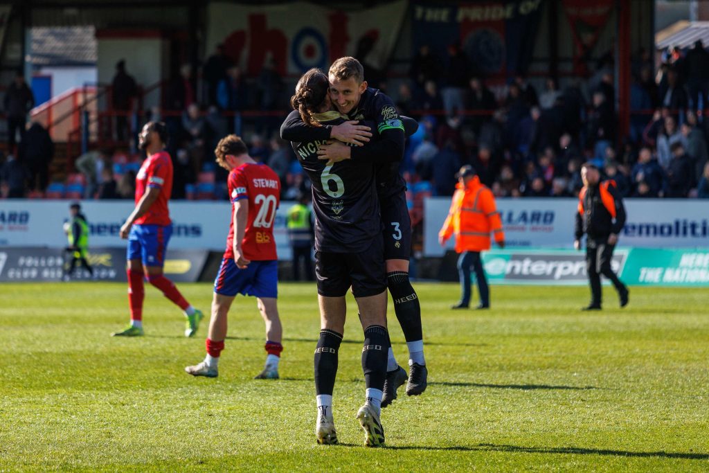 Gateshead celebrate preserving their National League status with a win at Aldershot Town