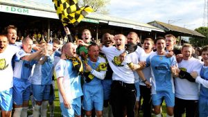 Burton Albion’s players celebrate winning promotion to the Football League