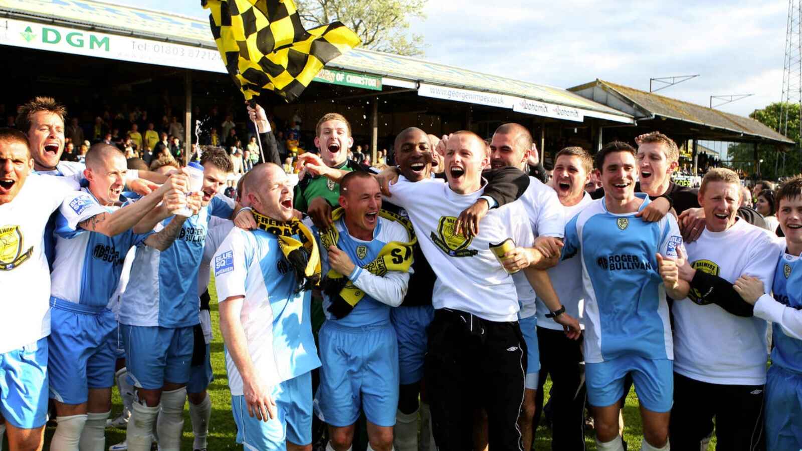 Burton Albion’s players celebrate winning promotion to the Football League
