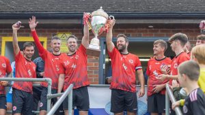 2025 winners Llanymynech lift the Graham Edwards Memorial Trophy.