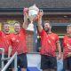 2025 winners Llanymynech lift the Graham Edwards Memorial Trophy.