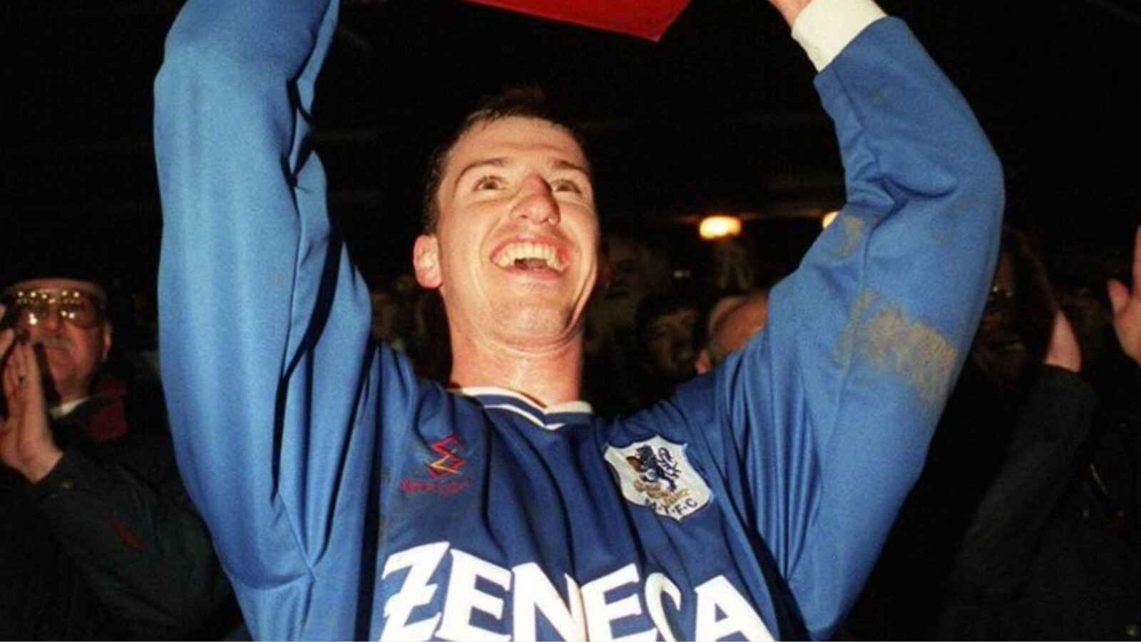 Macclesfield Town captain Neil Howarth shows off the Vauxhall Conference trophy