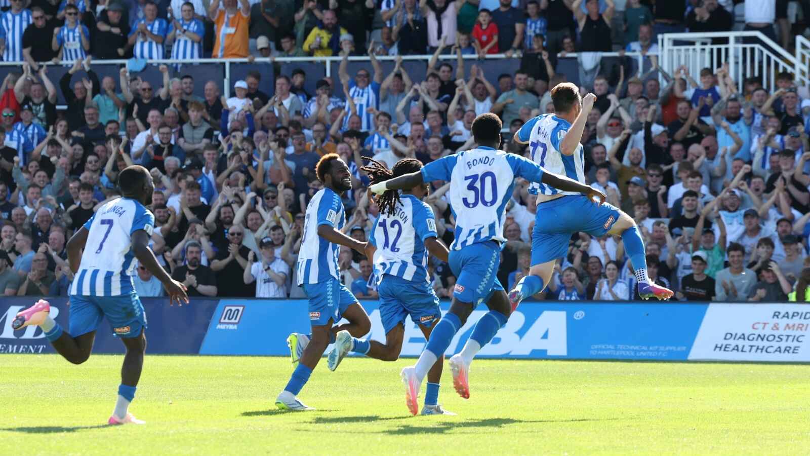 Hartlepool United’s players celebrate as a renewed sense of togetherness grows between the club and its supporters.