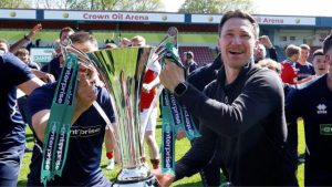 Stuart Maynard celebrates winning the National League with York City last season.