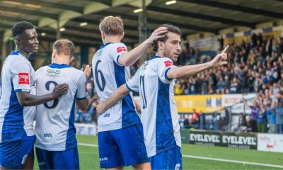 Bury players celebrate during their FA Trophy third qualifying round triumph over Gainsborough Trinity.