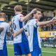 Bury players celebrate during their FA Trophy third qualifying round triumph over Gainsborough Trinity.