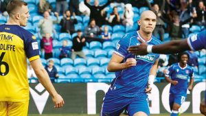 Carlisle United’s Georgie Kelly enjoys his first goal.