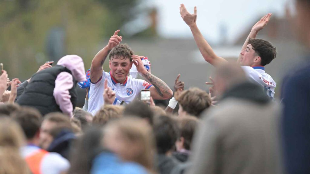 AFC Rushden & Diamonds hero Jack Daldy is hoisted up by joyous fans.