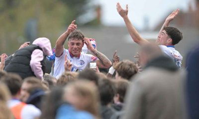 AFC Rushden & Diamonds hero Jack Daldy is hoisted up by joyous fans.