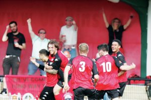 SMILES BETTER: Truro’s Jaze Kabia, second from right, celebrates his hat-trick PICTURE: Peter Trinder