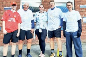BIG: Keith Hicks, second right, and family after finishing their first challenge