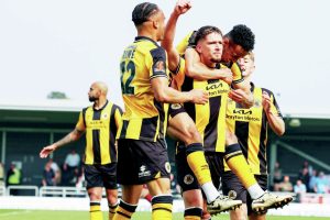 WE’RE STAYING UP: Boston’s Keaton Ward celebrates his goal with team-mates PICTURE: Chris Bray