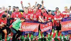 PARTY TIME: Truro City players celebrate title glory and, inset, skipper Connor Riley-Lowe wheels away after his goal PICTURE: Pinnacle
