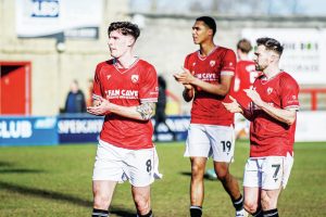 IT’S ALL OVER: Morecambe’s players contemplate the club’s relegation to the National League after 18 years away