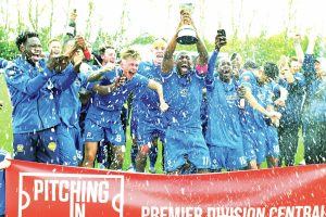 PUT TO BED: Captain Ryan Blake starts the title party for Bedford PICTURE: Mike Capps