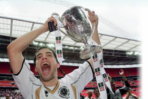 ECSTASY: Truro City’s Jake Ash holds the FA Vase aloft PICTURE: Martin Dalton
