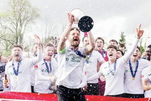 TROPHY TIME: Merthyr Town savour winning Southern Premier South PICTURE: John Smith