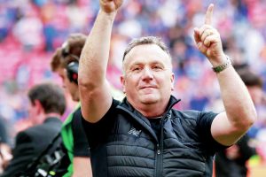 HEADING UP: Micky Mellon celebrates winning promotion with Oldham at Wembley – his third promotion into the EFL PICTURE: Alamy