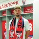 HOME COMFORTS: Alex Newby settles into his new surroundings in the York City dressing room PICTURE: York City FC