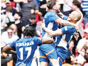 Oldham Athletic celebrate promotion to the EFL