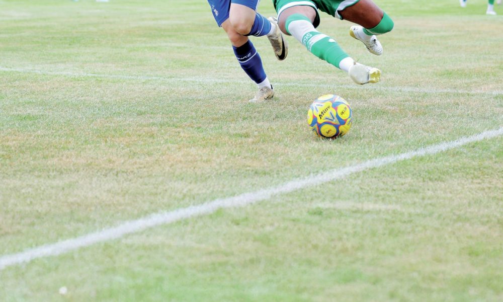 OUCH: Yeovil’s Morgan Williams is challenged by Exmouth’s Ben Griffith PICTURE: Gary House