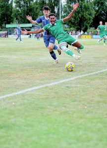 OUCH: Yeovil’s Morgan Williams is challenged by Exmouth’s Ben Griffith PICTURE: Gary House