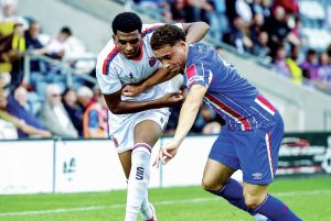 NO WAY PAST: Fylde’s Faris Mohammed, left, battles for the ball PICTURE: Steve Mclellan