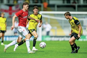 ON THE CHARGE: Morecambe’s Harvey MacAdam runs at the AFC Fylde defence PICTURE: Adam Gee