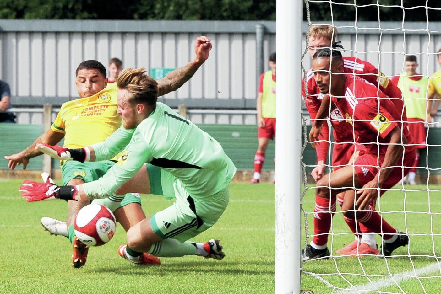 NAIM OF THE GAME: Runcorn’s Naim Arsan pokes the ball past James McClenaghan for the winning goal PICTURE: Greig Bertram