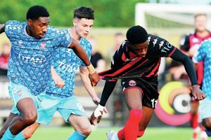 GETTING SHIRTY: Dominic Johnson-Fisher of Truro City is pulled back by York’s Malachi Fagan-Walcott PICTURE: Pinnacle