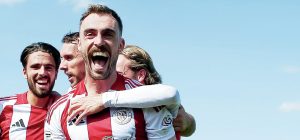 SAINTS ‘N’ WINNERS: Shane Byrne is mobbed by his Brackley Town team-mates after scoring the winner against Eastleigh last Saturday PICTURE: Mitch Davidson